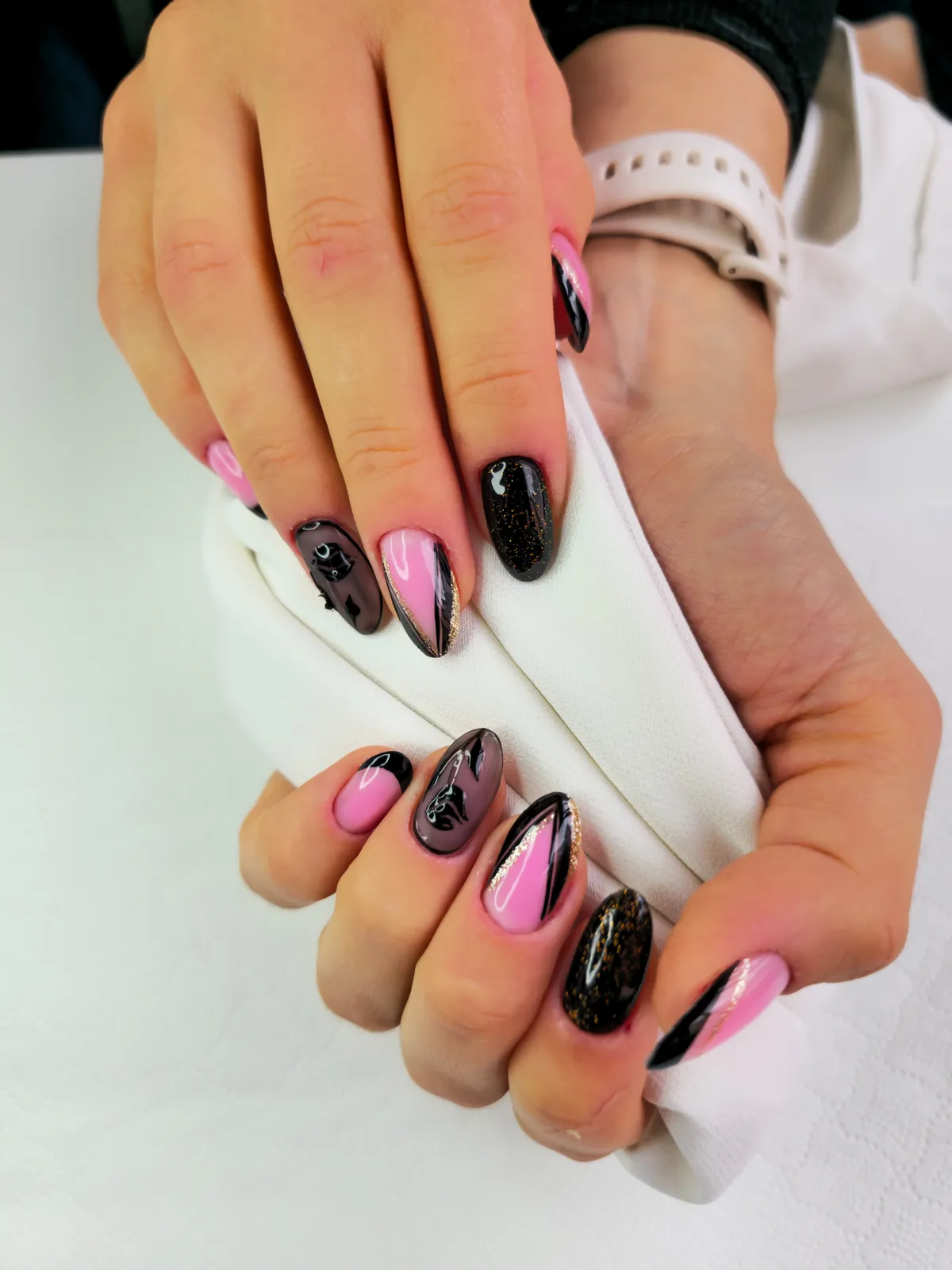 Black and hot pink nail art with chrome lines