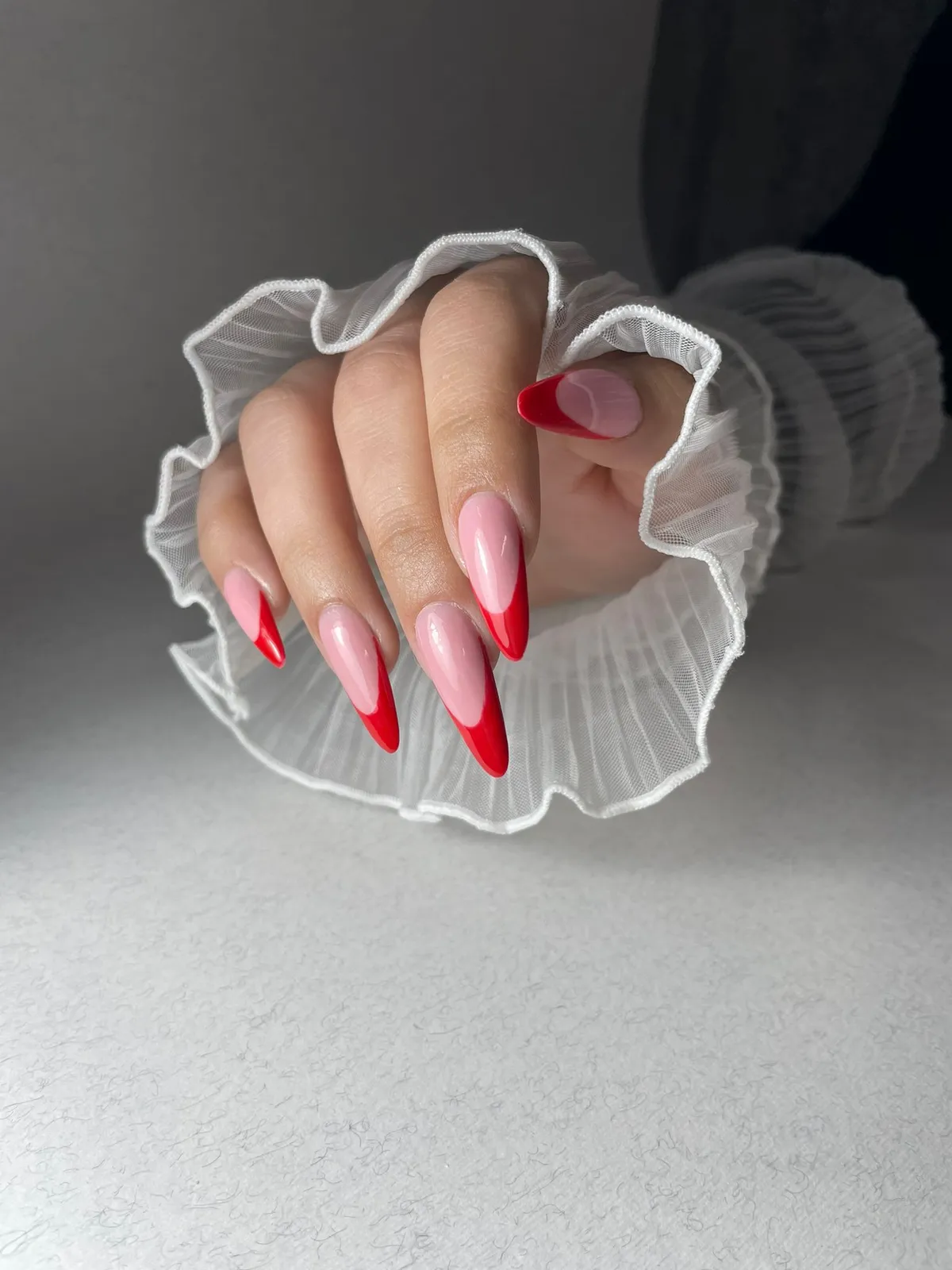 Almond nails with red French tips